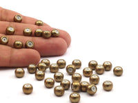 12 Raw Brass Bead keeper, silicone and  brass, (6x8mm) rondelle with 3.5mm hole Y263